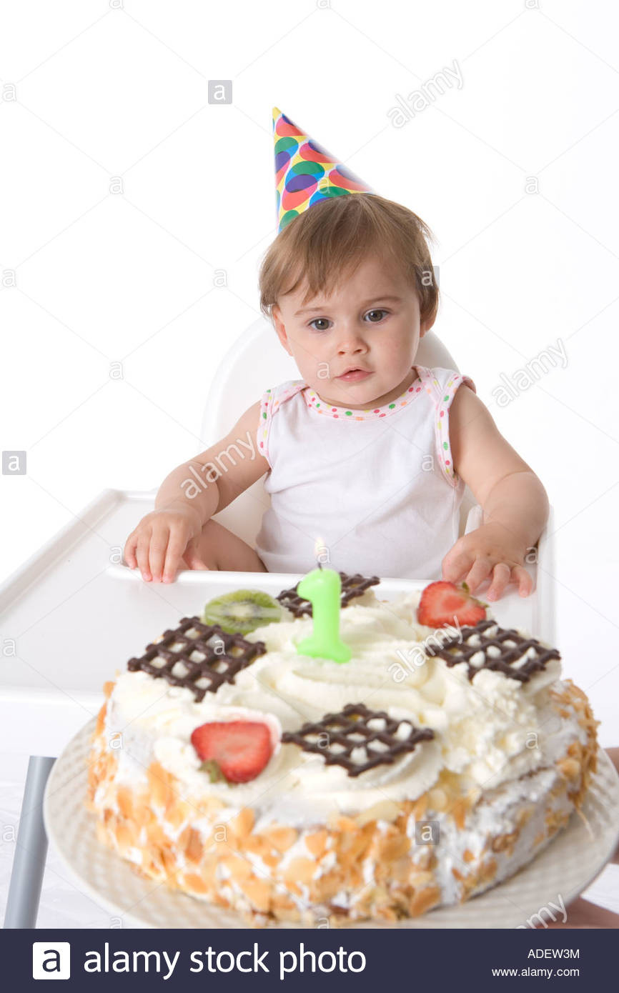 Birthday Cake For 1 Year Old Baby Girl
 e year old baby girl looking at her birthday cake Stock