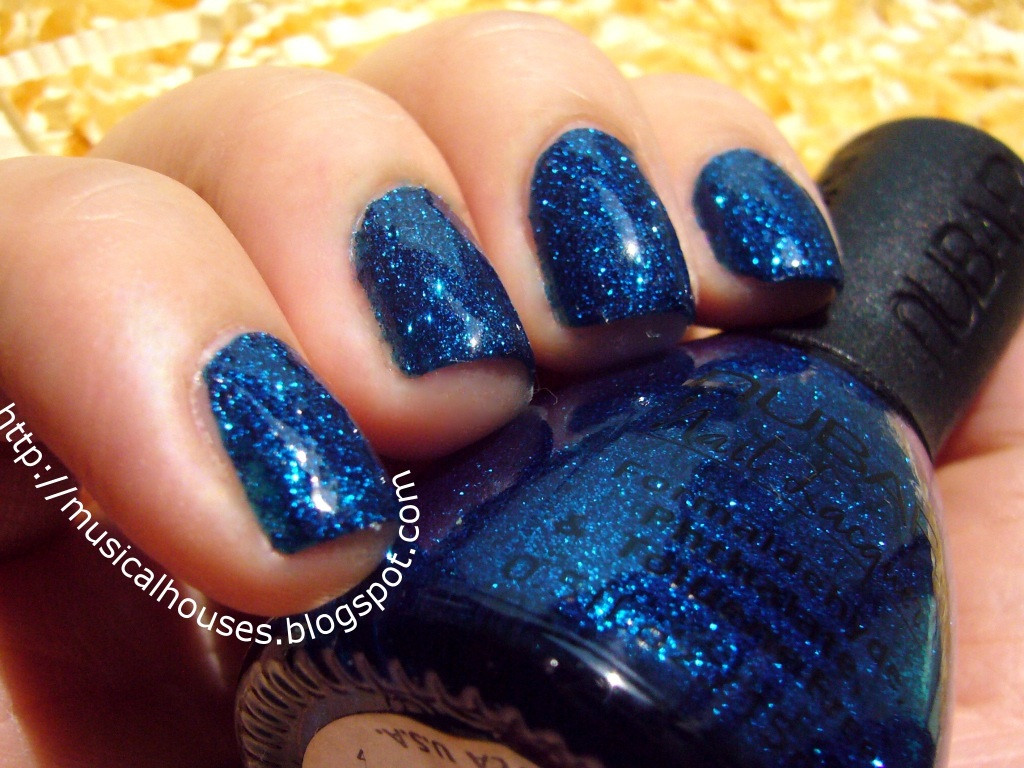 Blue Nails With Glitter
 Nubar Night Sparkle Glitter Made Glamorous of Faces and