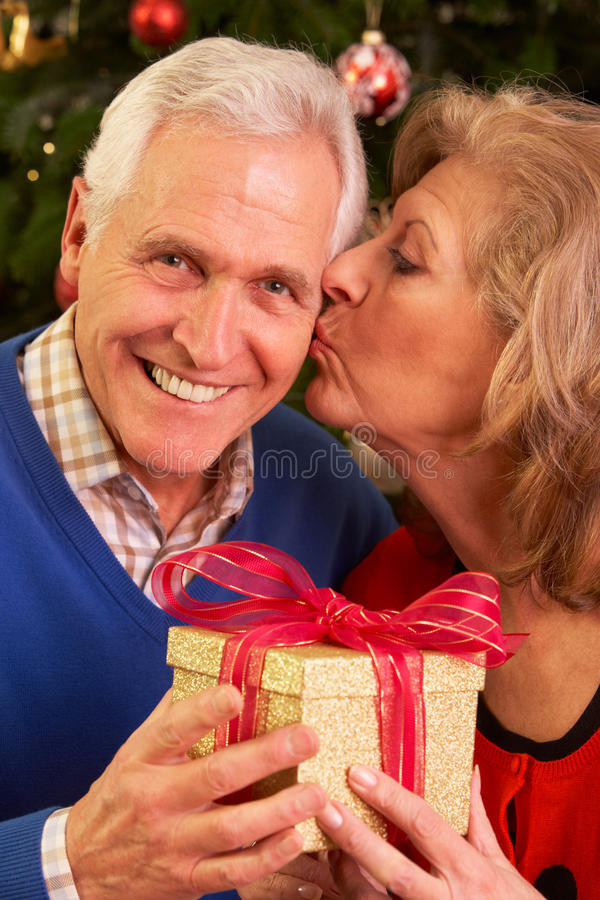 Christmas Gift Ideas For Older Couples
 Senior Couple Exchanging Christmas Gifts Stock Image