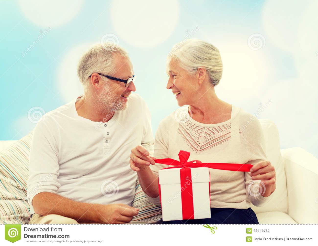 Christmas Gift Ideas For Older Couples
 Happy Senior Couple With Gift Box At Home Stock