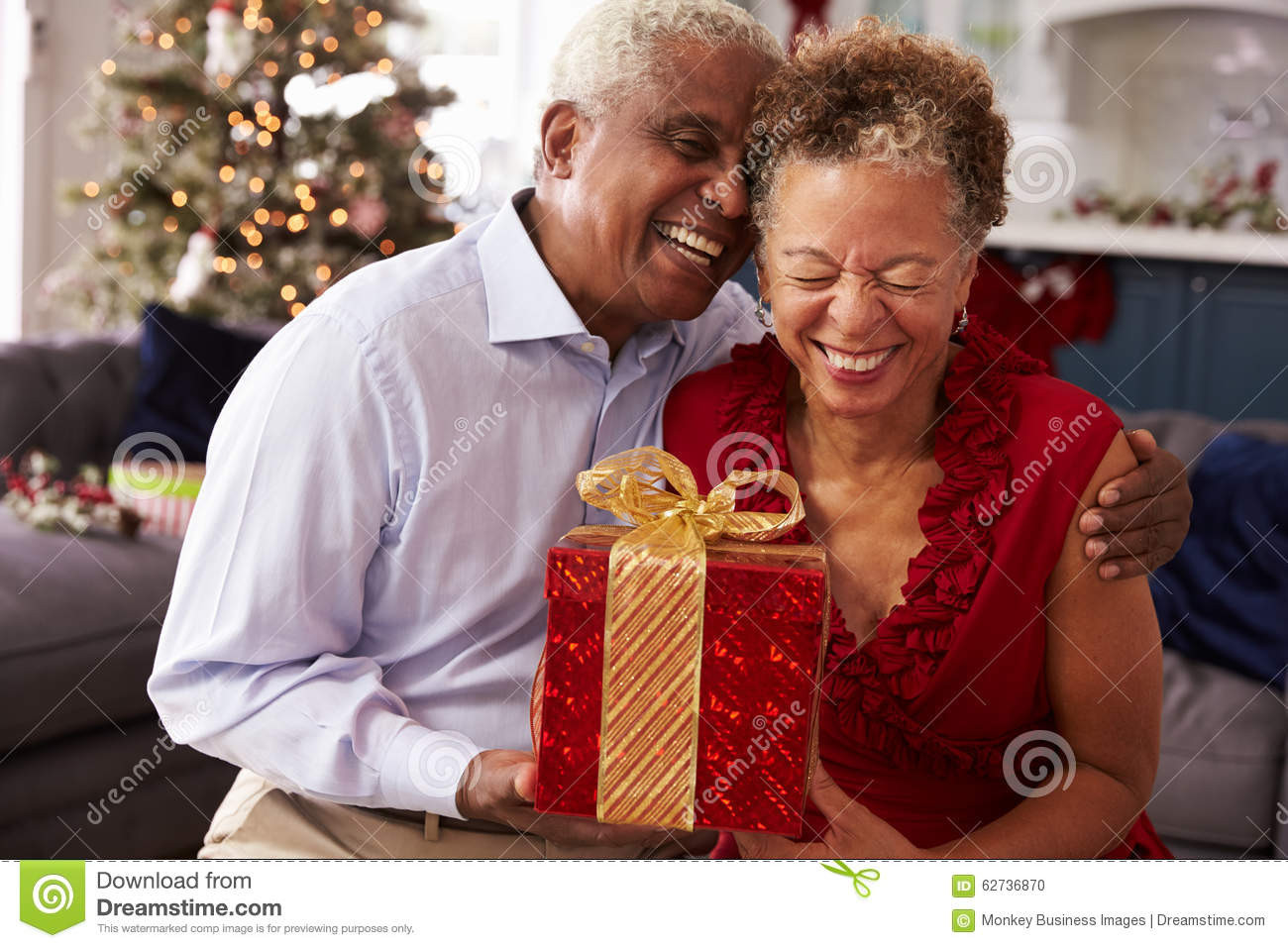 Christmas Gift Ideas For Older Couples
 Senior Couple Exchanging Christmas Gifts At Home Stock