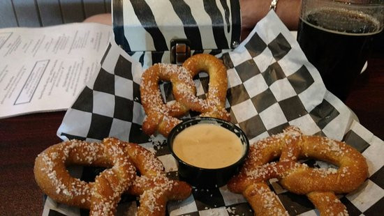 Deep Fried Pretzels
 Pastrami burger with onion rings Picture of Jake s Bar