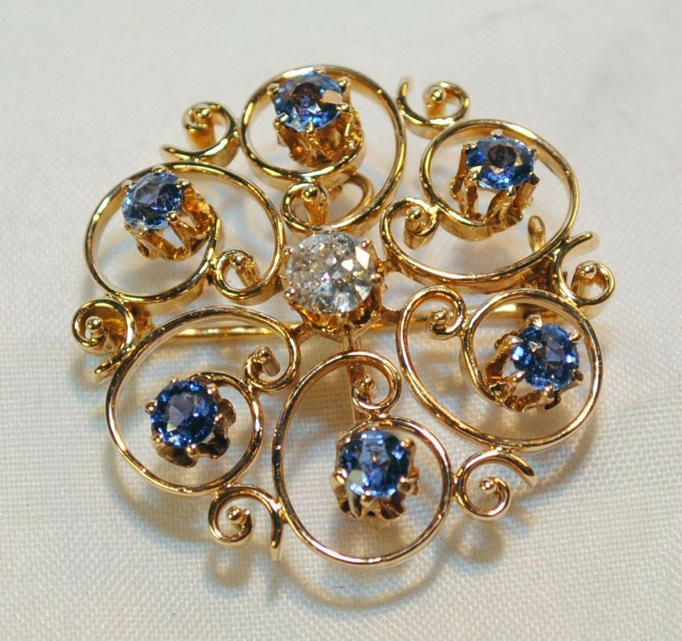 Diamond Brooches
 VINTAGE SAPPHIRE AND DIAMOND SCROLL BROOCH PIN AND PENDANT