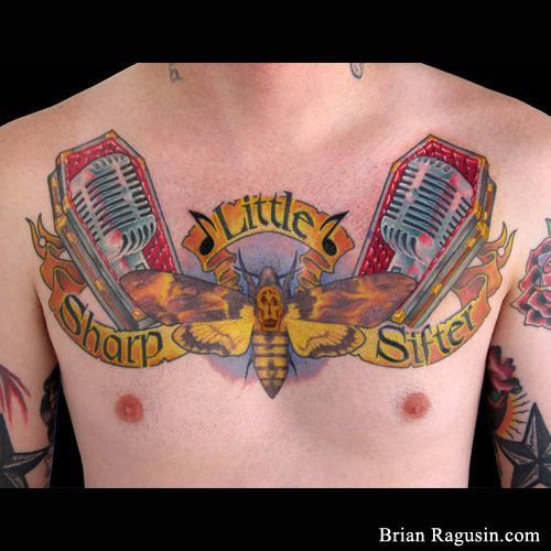 Dip In Gravy Crossword
 Chest piece with vintage microphones coffins and a