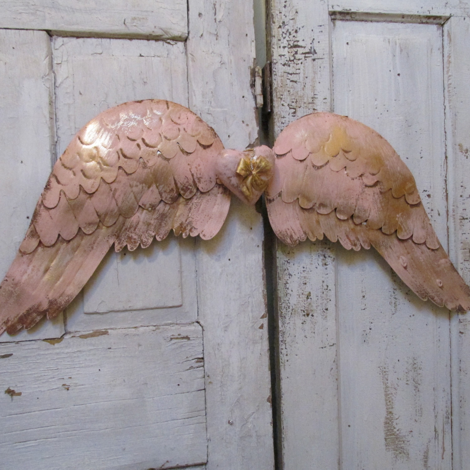 DIY Angel Wings Wall Decor
 Pink metal tin angel wings wall decor with centerpiece