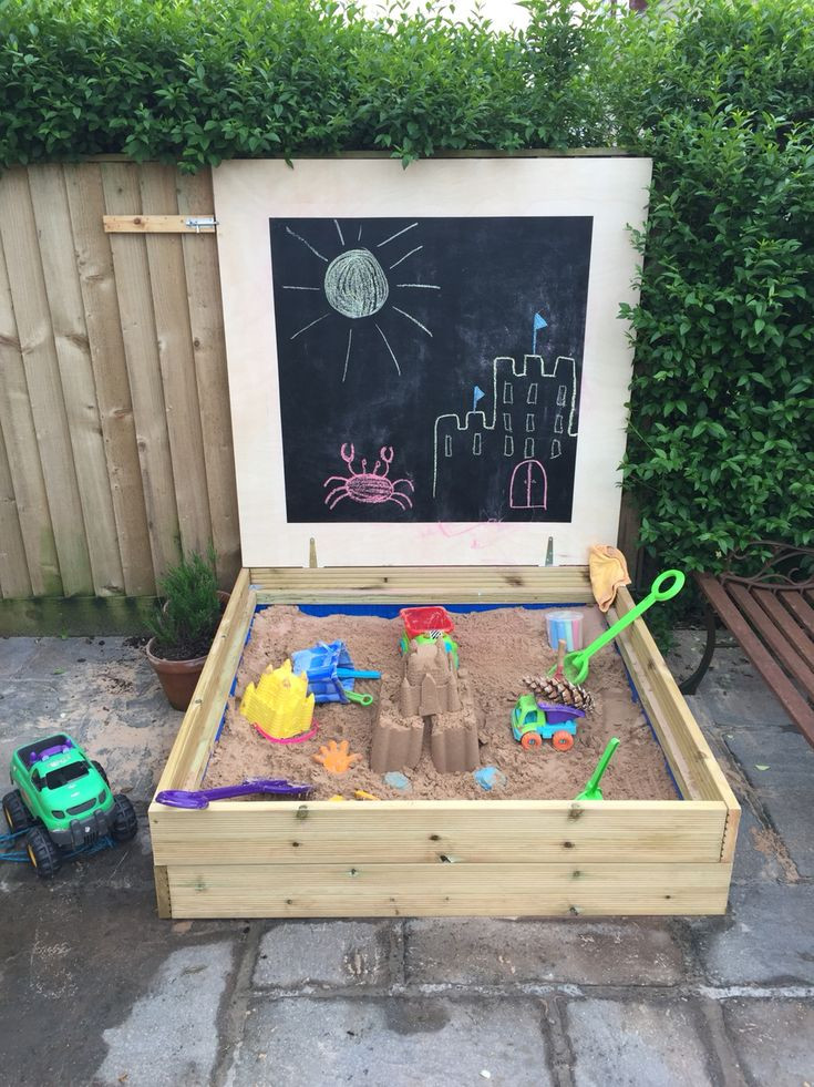 DIY Kids Sandbox
 Homemade sandpit using decking board and a blackboard lid