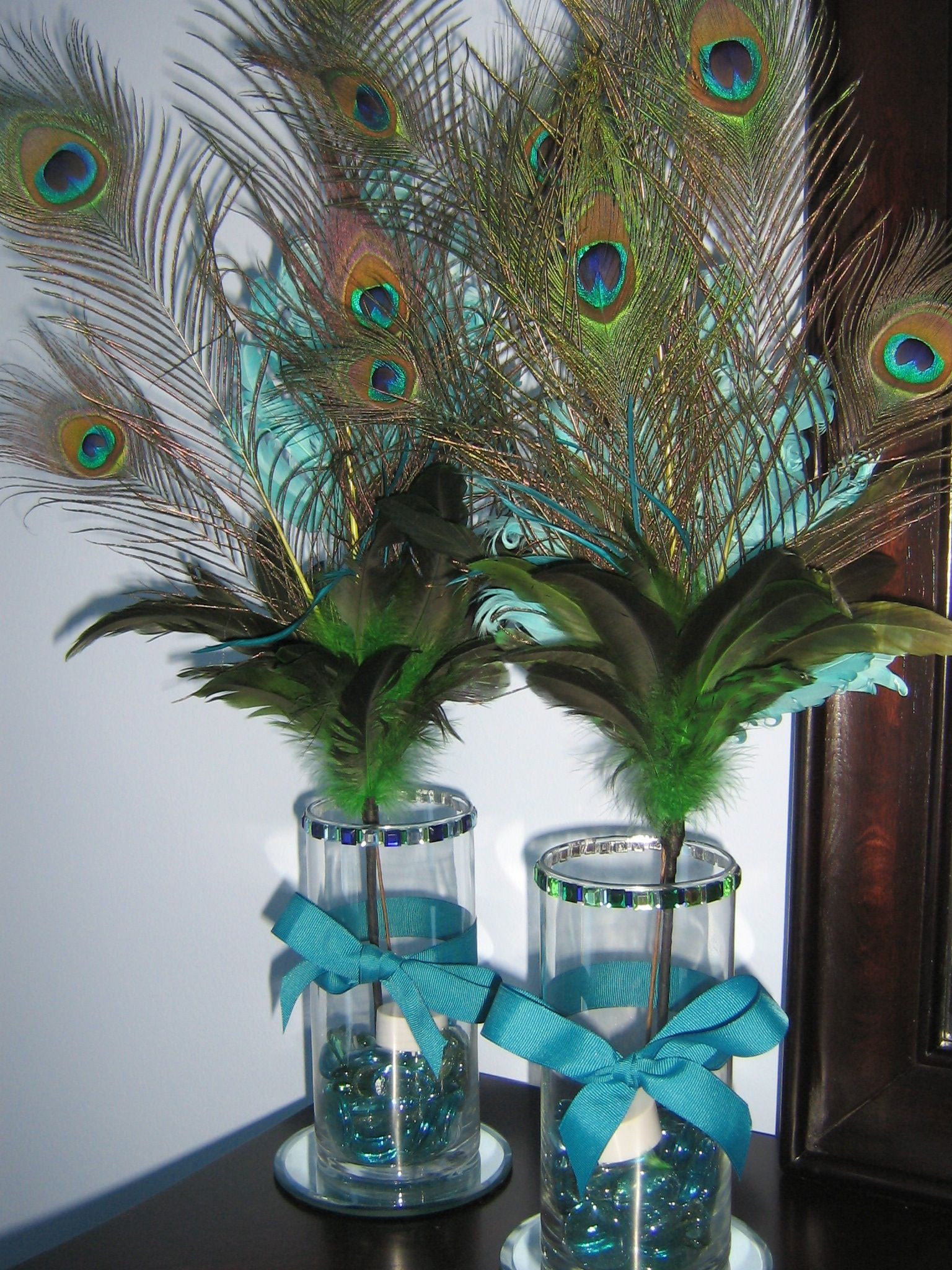 DIY Peacock Party Decorations
 DIY Peacock Feather Centerpieces For a pretty glow add