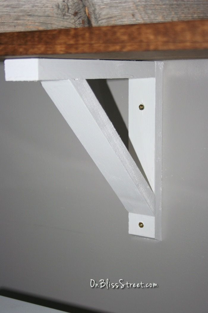 DIY Wood Shelf Bracket
 White DIY shelf bracket installed onto gray wall