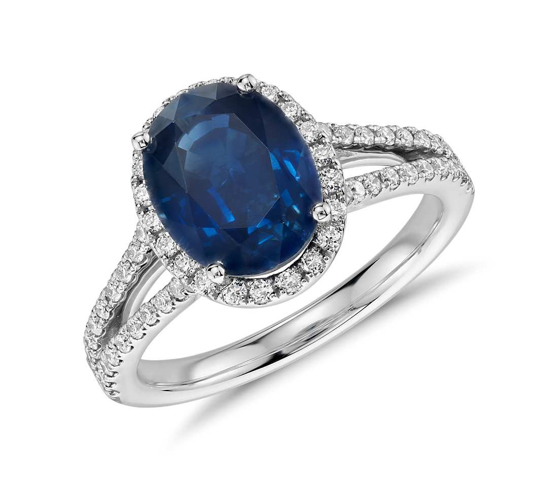 Gemstone Wedding Rings
 Oval Sapphire and Diamond Halo Split Shank Ring in 18k