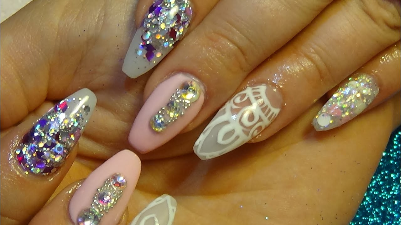 Glitter On Nails
 beautiful pink & glitter acrylic nails with hand painted
