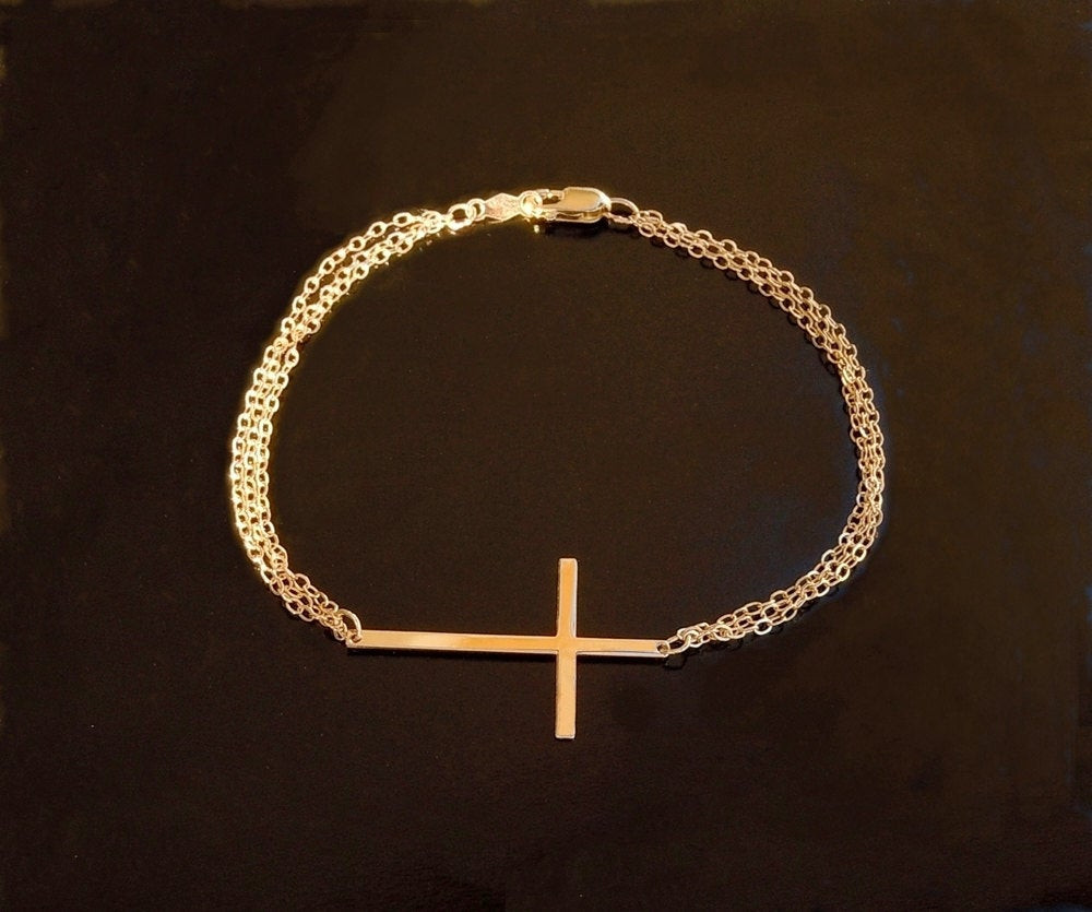 Gold Cross Bracelet
 14KT Gold Sideways Cross Bracelet with Triple Chain