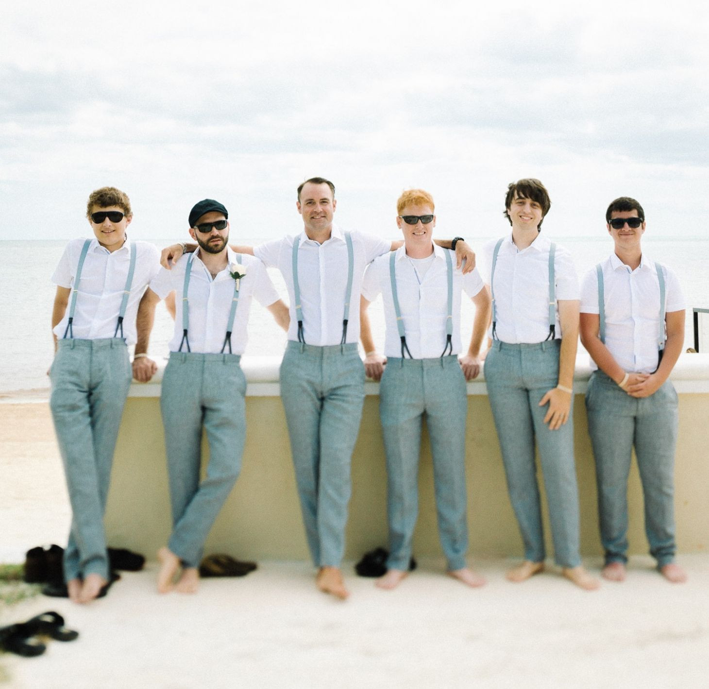 Groomsmen Beach Wedding
 Groomsmen at a beach wedding with grey slacks and light