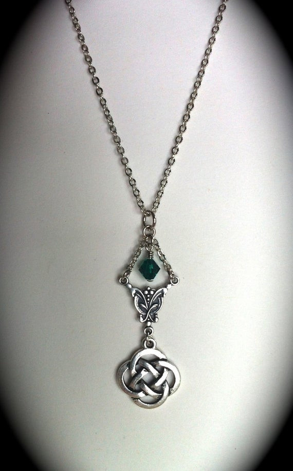 Love Knot Necklace
 Celtic Love Knot Necklace Emerald Swarovski by GracieWieber
