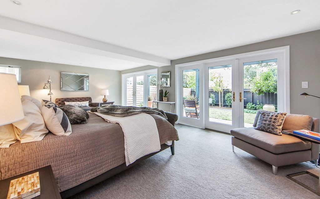 Master Bedroom French Doors
 Contemporary Master Bedroom with French doors & Carpet in