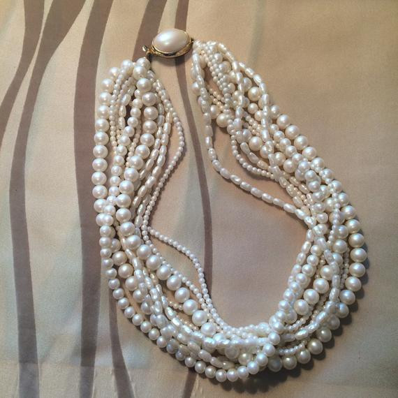 Multi Strand Necklace
 Multi Strand Faux Pearl Necklace by OurLadyofCraft on Etsy