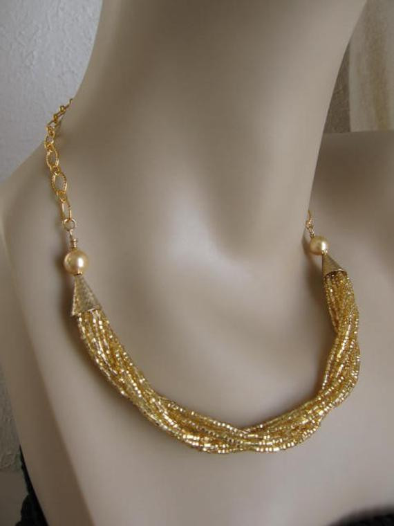 Multi Strand Necklace
 Multi Strand Twist Seed Bead Necklace Gold