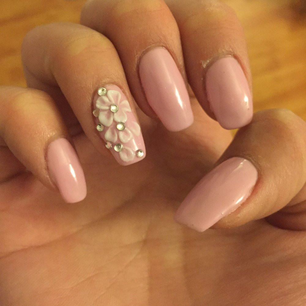 Nail Art 3d
 Pink gels with white 3D nail art with jewels on natural
