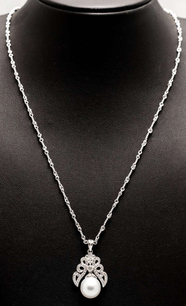 Pearl And Diamond Necklace
 South Sea Pearl and Diamond Pendant Necklace in White Gold