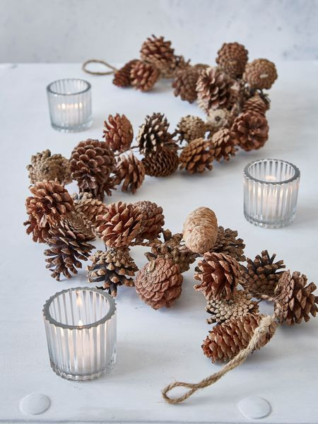 Pine Cone Wedding Decorations
 This lovely pine garland will add a cosy rustic ski lodge