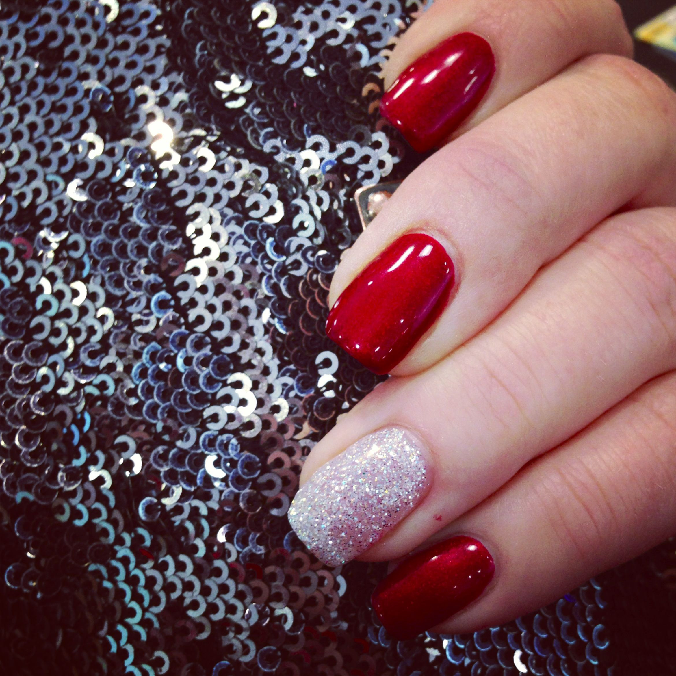 Red Nails With Silver Glitter
 Red gel nails with silver rockstar glitter accent