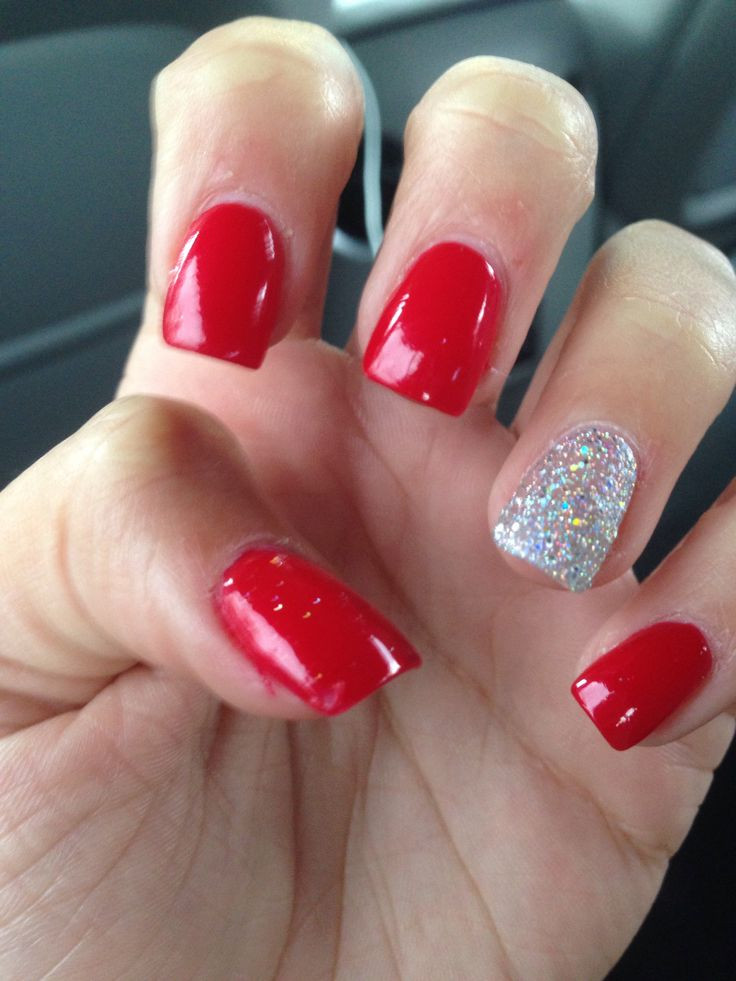 Red Nails With Silver Glitter
 Acrylics Red with glitter nail on ring finger