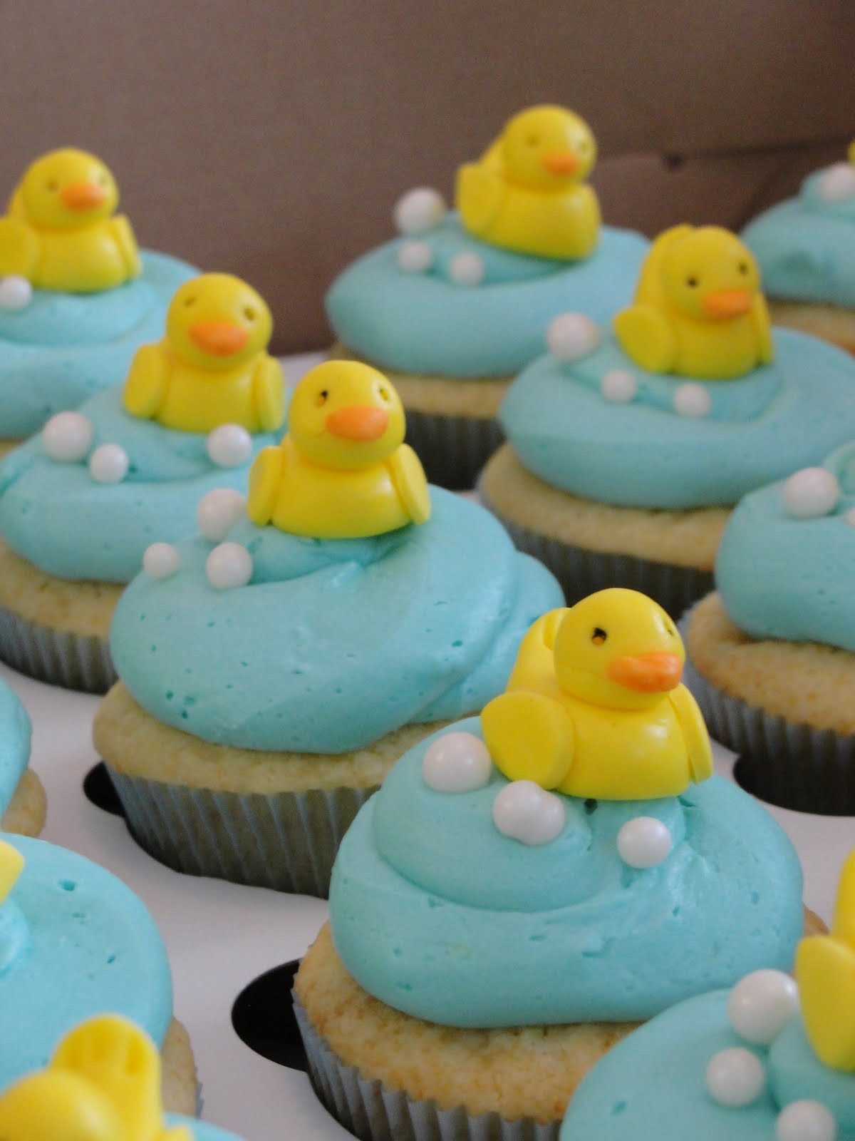 Rubber Duckie Cupcakes
 Oh just put a cupcake in it Rubber Duckie Cupcakes