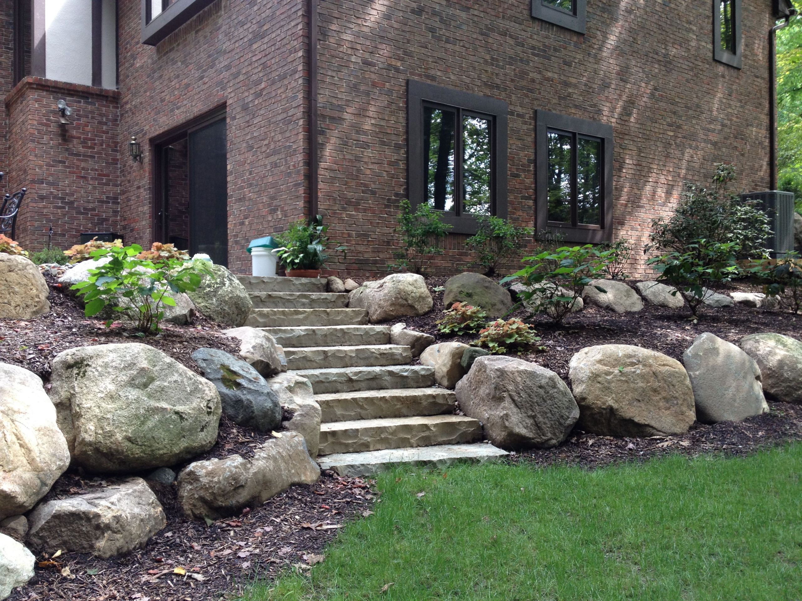 Terrace Landscape With Boulders
 Boulder Retaining Wall and Limestone Steps for Naturalized