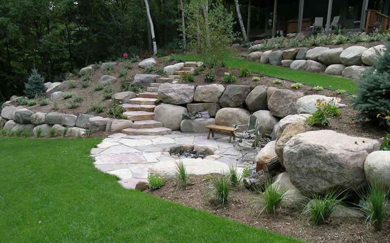 Terrace Landscape With Boulders
 flagstone patio with firepit and built in boulders just