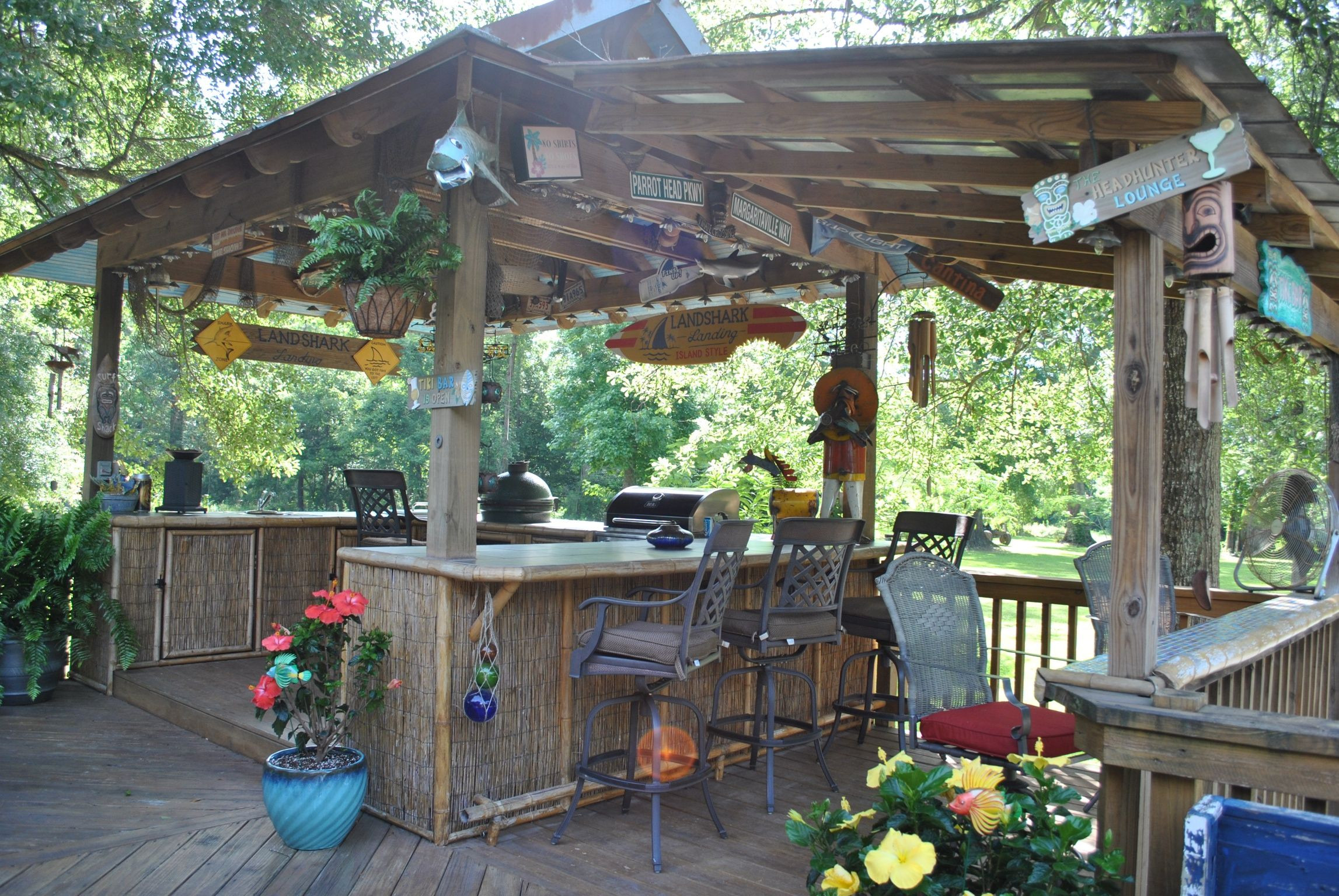 Tiki Backyard Ideas
 BBQ shack but with wood & corregated metal cabinets
