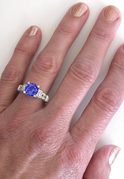 Wedding Bands And Engagement Rings
 8mm Round Tanzanite Engagement Ring with three matching
