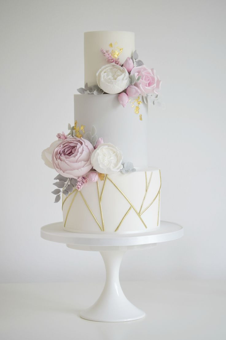 Wedding Cakes Designs 2020
 Geometric gold light blue and flowers wedding cake
