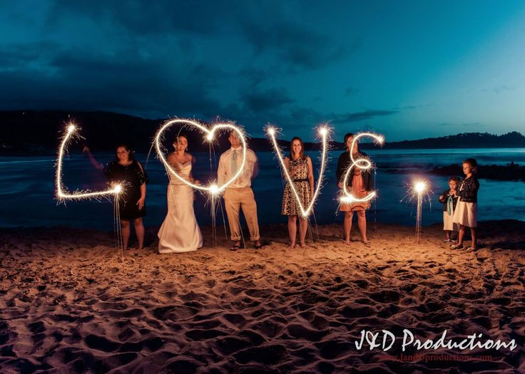 Wedding Sparklers Houston
 Spelling out "love" with sparklers on the beach at Lisa