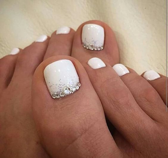 White Toe Nail Designs
 Picture white nails with silver glitter and beads on