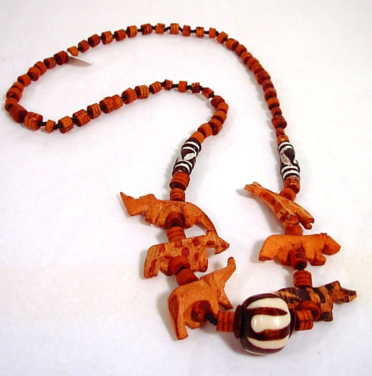 Wooden African Necklace
 Carved Wooden African Animal Necklace by Kokorokoko on Etsy