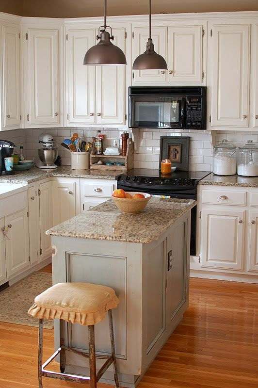 Small White Kitchen Island
 White cabinets notice the scalloped wood detail under the