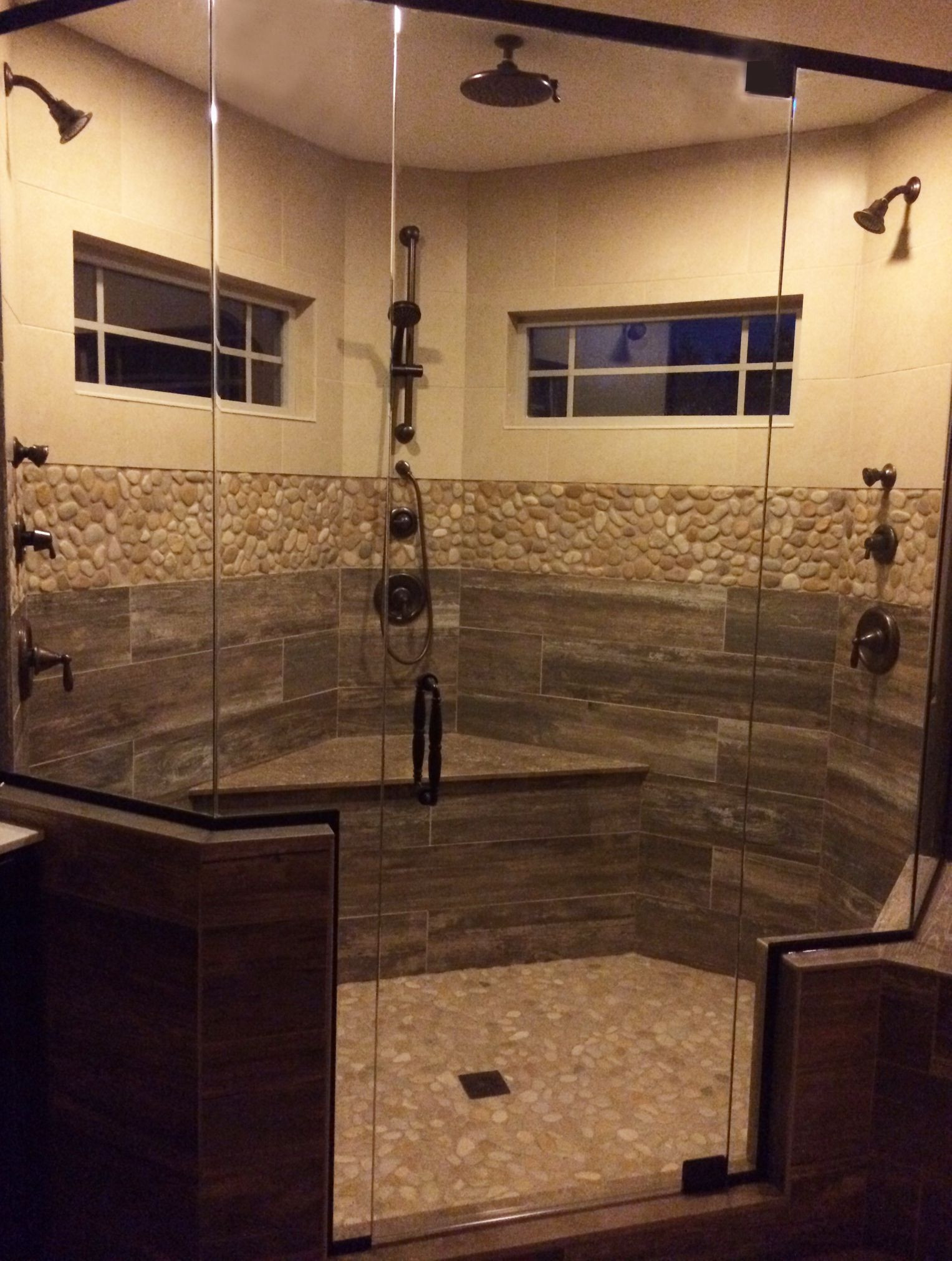 Wood Tile Bathroom Shower
 Finished Shower Remodel Faux wood plank tile river rock