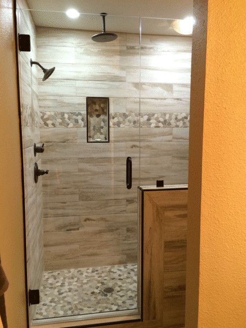 Wood Tile Bathroom Shower
 Master Shower with Wood plank tile flat river rock deco